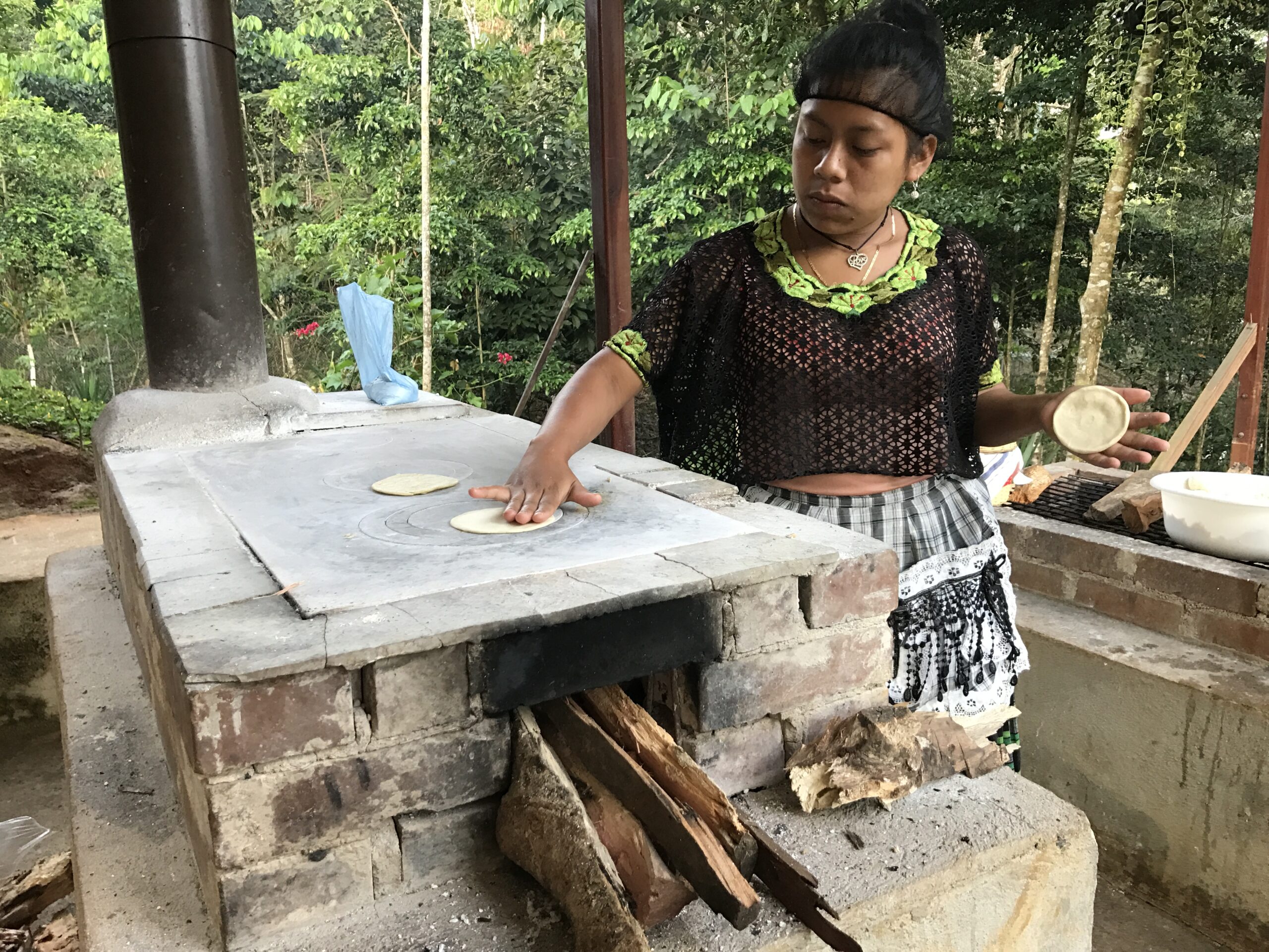 Guatemalan woman cooking on stove top
